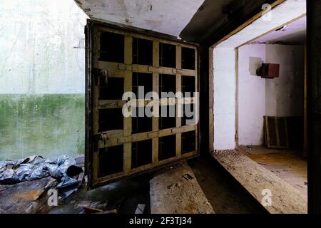 Opened heavy steel armored hermetic door in the Soviet bomb shelter Stock Photo