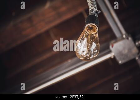 View of an old tungsten spotlight with unfocused background and space for text Stock Photo