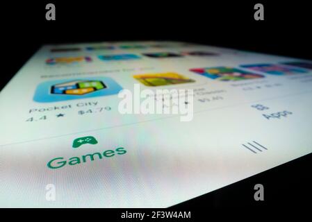 Close-up view of games for sale in Google Play Store Stock Photo