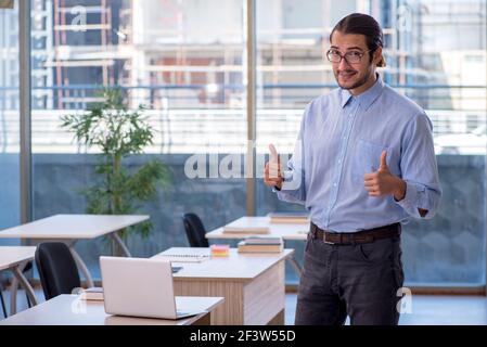 Young teacher in the classroom Stock Photo