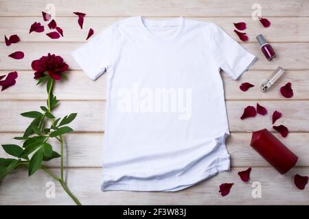 Blank red burgundy t-shirt mockup on clothes (1603545)