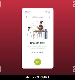 food blogger in uniform cooking pizza in kitchen recording video blog with camera on tripod blogging concept chef explaining how to cook a dish Stock Vector