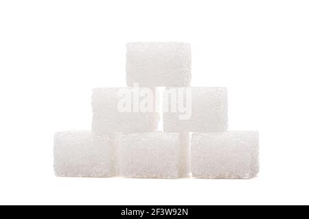 Sugar cubes on one another, isolated on white background Stock Photo
