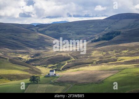 The ancient historic Corgarff Castle, in Strathdon, Aberdeenshire, Scotland viewed from the Lecht Road on a sunny day Stock Photo
