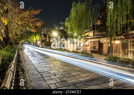 Long exposure night view of the road along the Shirakawa river in the Gion area of Kyoto, Japan. Stock Photo