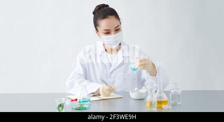 Scientist developing cosmetic product in laboratory, closeup Stock Photo
