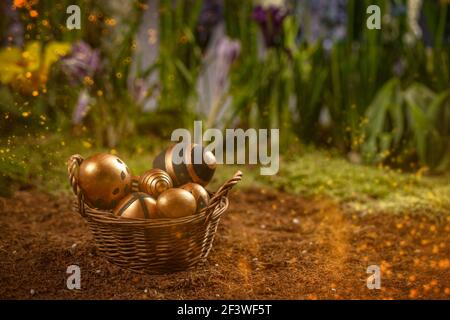 Easter eggs in wicker basket with spring flowers on the background Stock Photo