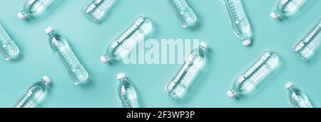 Water balance. Water bottles pattern for healthy lifestyle on blue background. Top view. Copy space. World water day. Pollution, environmental Stock Photo