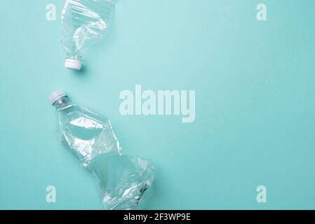 Plastic bottles on blue background. top view. Recycle plastic, waste pollution concept. Top view, copy space. Environmental protection concept. Reuse Stock Photo