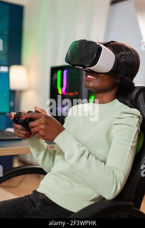 Pro woman egame cyber playing online with virtual reality headset and  wireless controller. Virtual space shooter championship in cyberspace,  esports player performing on pc during gaming tournament Stock Photo - Alamy