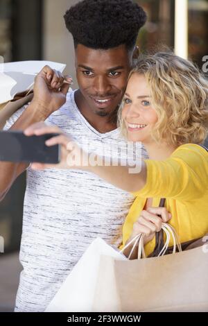 multiethnic couple taking selfie Stock Photo