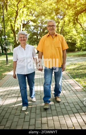 Active seniors walk in nature, happy healthy life Stock Photo