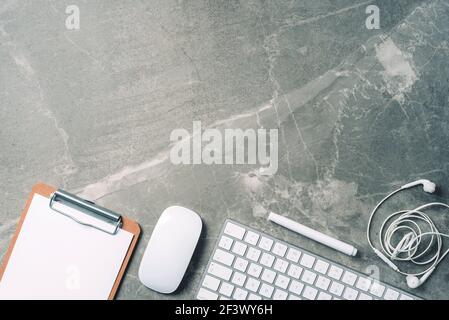 Business composition with white computer keyboard, mouse, clipboard, paper on marble background. Coffee break concept. Top view with copy space for Stock Photo