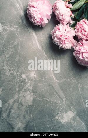 Floral pattern, frame made of pink peonies on marble background. Flat lay, top view. Copy space. Valentine's background. Wedding, birthday Stock Photo