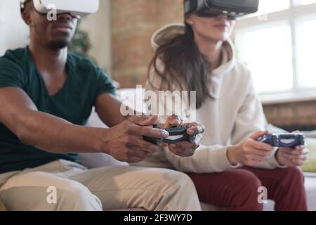 Young people having fun with new technology console online Stock Photo