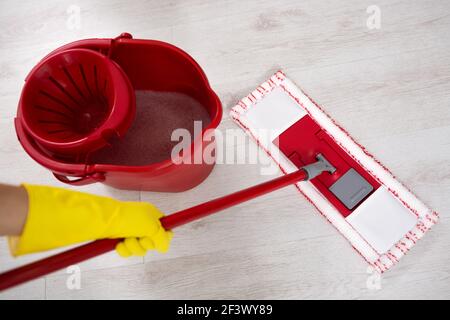 Woman doing cleaning floor at home close up Stock Photo