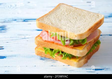 Big tasty sandwich on rustic wooden background Stock Photo