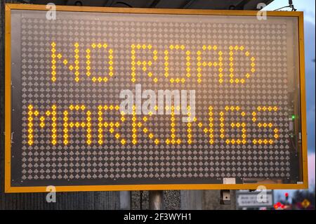 LED traffic control road sign solar powered message board mobile trailer variable message signs displaying No Road Markings along motorway in Dublin Stock Photo