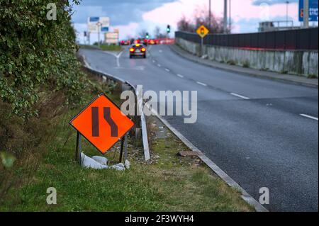 Temporary road sign indication road narrowing from right, Dublin, Ireland Stock Photo