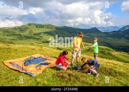 Tent setup for an overnight stay in the mountains Stock Photo