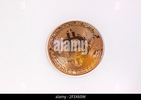 Physical bitcoin coin. Bitcoin on white background. Stock Photo
