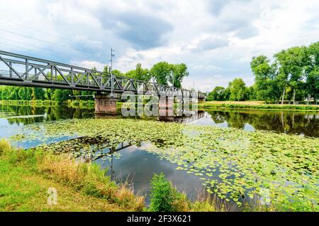 Metal railway bridge spanning the River Labe in Nymburk, Czech republic Stock Photo