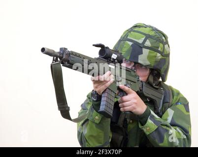 A soldier, with Automatic Carbine 5C (Ak 5C), in the Swedish Armed Forces, Ground Combat School in Kvarn. Stock Photo