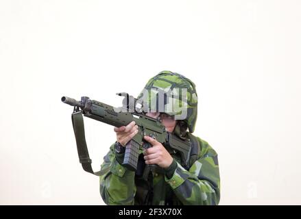 A soldier, with Automatic Carbine 5C (Ak 5C), in the Swedish Armed Forces, Ground Combat School in Kvarn. Stock Photo