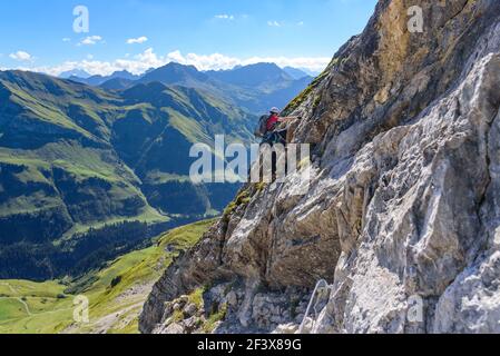 Via Ferrata climbing in high alpine region Stock Photo