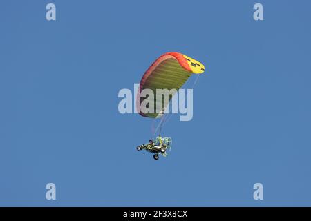 Paragliding on a sunny blue sky day Stock Photo