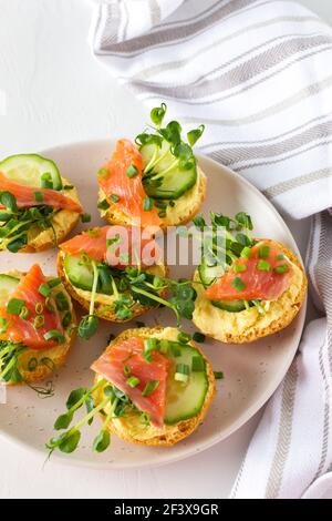 Toasted bread with cucumber on plate, isolated on white Stock Photo - Alamy