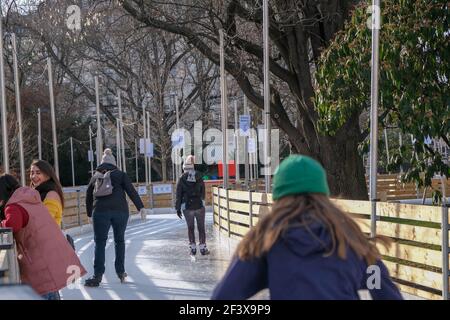 Vienna, Austria - February 18, 2021: Ice skating in front of the Vienna Town Hall. Stock Photo