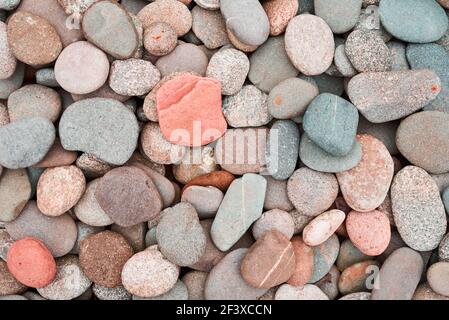 Colored round stones background. Pebbles texture Stock Photo