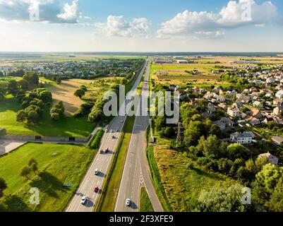 Aerial view of a highway road. Cars passing, highway junction, cross roads. Kaunas, Lithuania