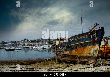 Boat wrecks in a habour in Brittany Stock Photo