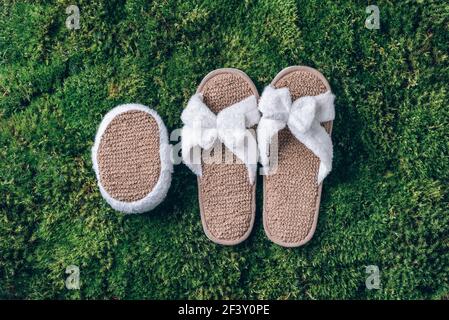 Spa tools white towel bamboo slippers brush on green grass