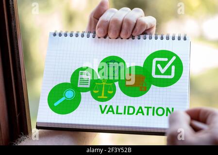 Hand drawing validation concept on a notepad Stock Photo