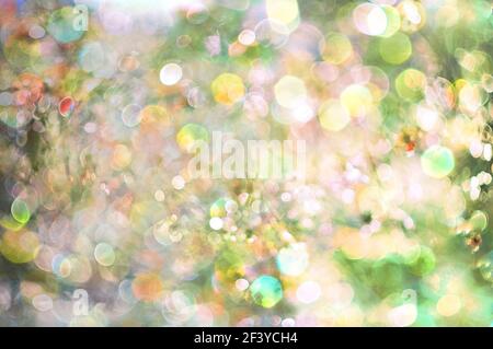 spring bokeh abstract blurred yellow cyan background, sun glare background. High quality photo Stock Photo