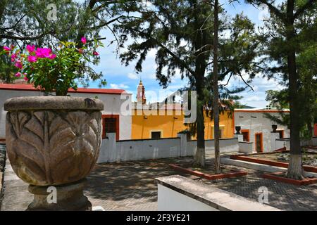 Scenic view of Plaza del Santuario with the colorful Colonial buildings on the old quarry streets of Armadillo de Los Infante, San Luis Potosí Mexico. Stock Photo