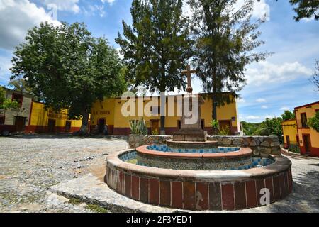 Scenic view of Plaza del Santuario with the colorful Colonial buildings on the old quarry streets of Armadillo de Los Infante, San Luis Potosí Mexico. Stock Photo
