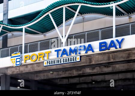 Tampa, USA - April 27, 2018: Port of Tampa bay in downtown Florida city with sign for parking lot garage at commercial cargo shipping and cruise termi Stock Photo