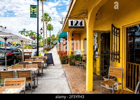 Venice, USA - April 29, 2018: Welcome to historic old town of Italian city district in Florida with 124 sidewalk restaurant with outdoor sitting area Stock Photo