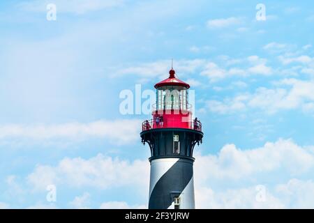 St. Augustine, USA - May 10, 2018: St. Augustine Lighthouse and Maritime Museum in Florida city in summer with people walking on top floor isolated ag Stock Photo