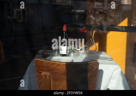 Set table on empty restaurant in London, Fuhlam Road, during Covid -19 pandemoc lockdown, March 2021, London,UK Stock Photo
