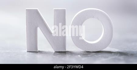 Word NO made with cement letters on grey marble background. Copy space. Business concept Stock Photo