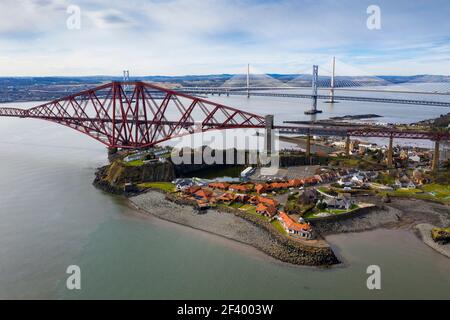 North Queensferry, UK. 18th Mar 2021.  Spring Weather: Panoramic view of the three bridges that span the Firth of Forth at North Queensferry, The Forth Rail Bridge, Forth Road bridge and the Queensferry Crossing. Credit: Ian Rutherford/Alamy Live News.