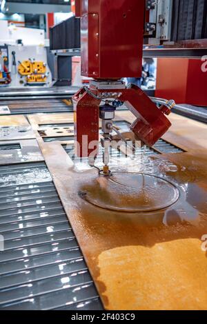 CNC water jet cutting machine. CNC water jet cutting machine modern industrial technology. Stock Photo