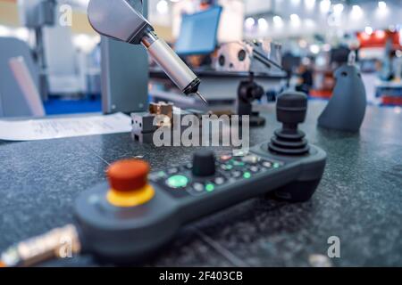 Quality control measurement probe. Metalworking CNC milling mach. Quality control measurement probe. Metalworking CNC milling machine. Cutting metal modern processing technology. Small depth of field. Warning - authentic shooting in challenging conditions. Stock Photo