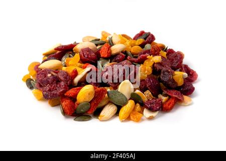 Trail mix with dried fruits, nuts and raisins on a white background Stock Photo