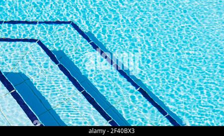 Overhead photography of ripples of water by steps in swimming pool Stock Photo